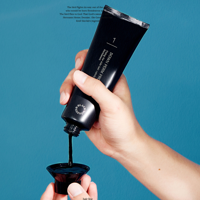 BLACK MONSTER Downperm Pro Kit 120ml held by a gentleman pouring black solution into a small bowl for professional Korean men's grooming by Gentleman Korea