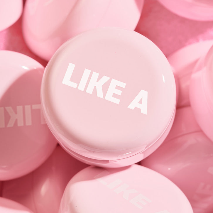 BLESSED MOON Mini Like A Shadow pink jar with 'LIKE A' text visible on top, surrounded by similar jars.