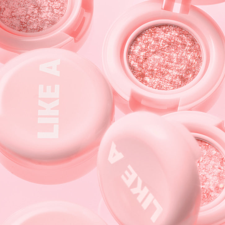 BLESSED MOON Mini Like A Shadow makeup compact in light pink with sparkly interior, showcasing elegant and trendy design.