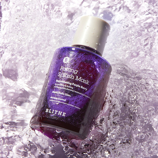 BLITHE Patting Splash Mask Rejuvenating Purple Berry 70ml/150ml on a wet surface, showcasing its vibrant purple bottle.