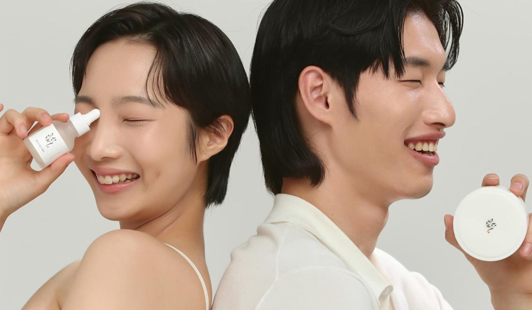 Smiling individuals showcasing skincare products, suggesting a joyful skincare routine.
