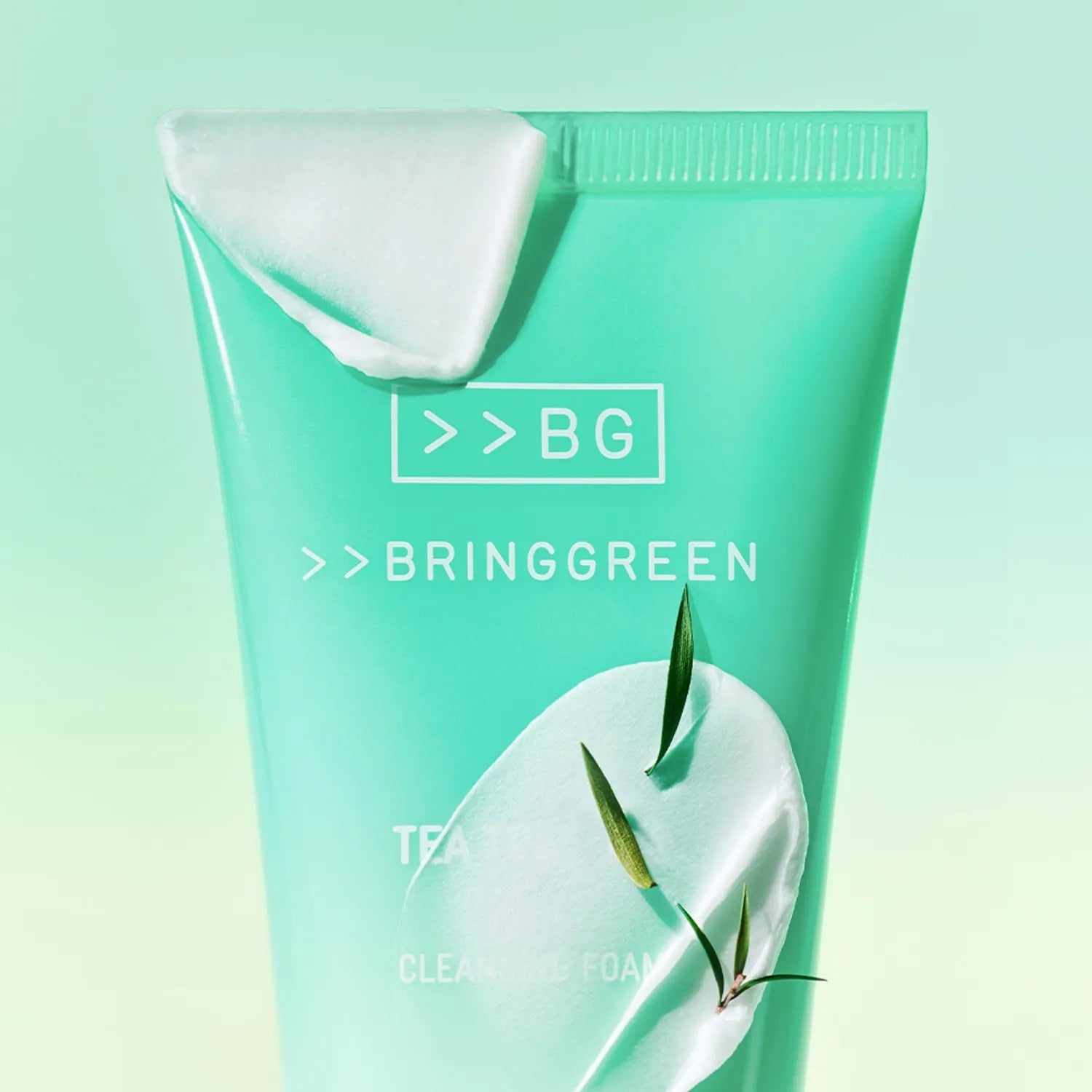 BRINGGREEN Tea Tree Cica Deep Cleansing Foam 120ml tube on a gradient green background with leaves