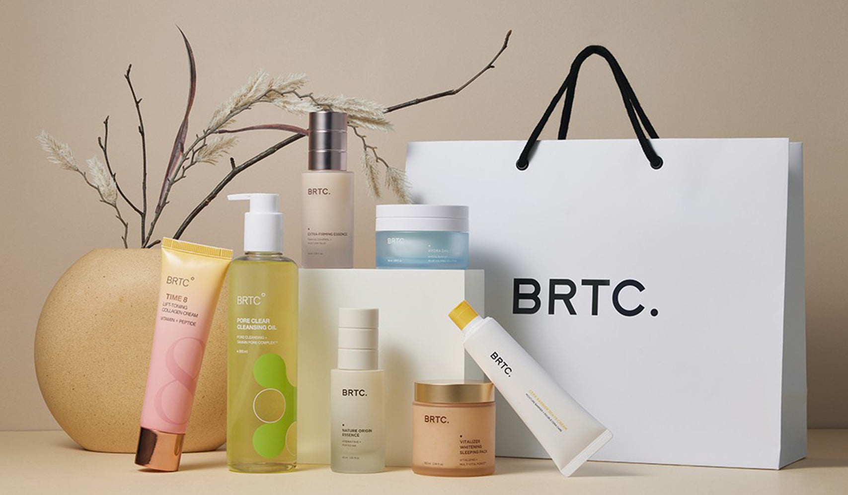 BRTC skincare products displayed with shopping bag and decorative vase on a beige backdrop.