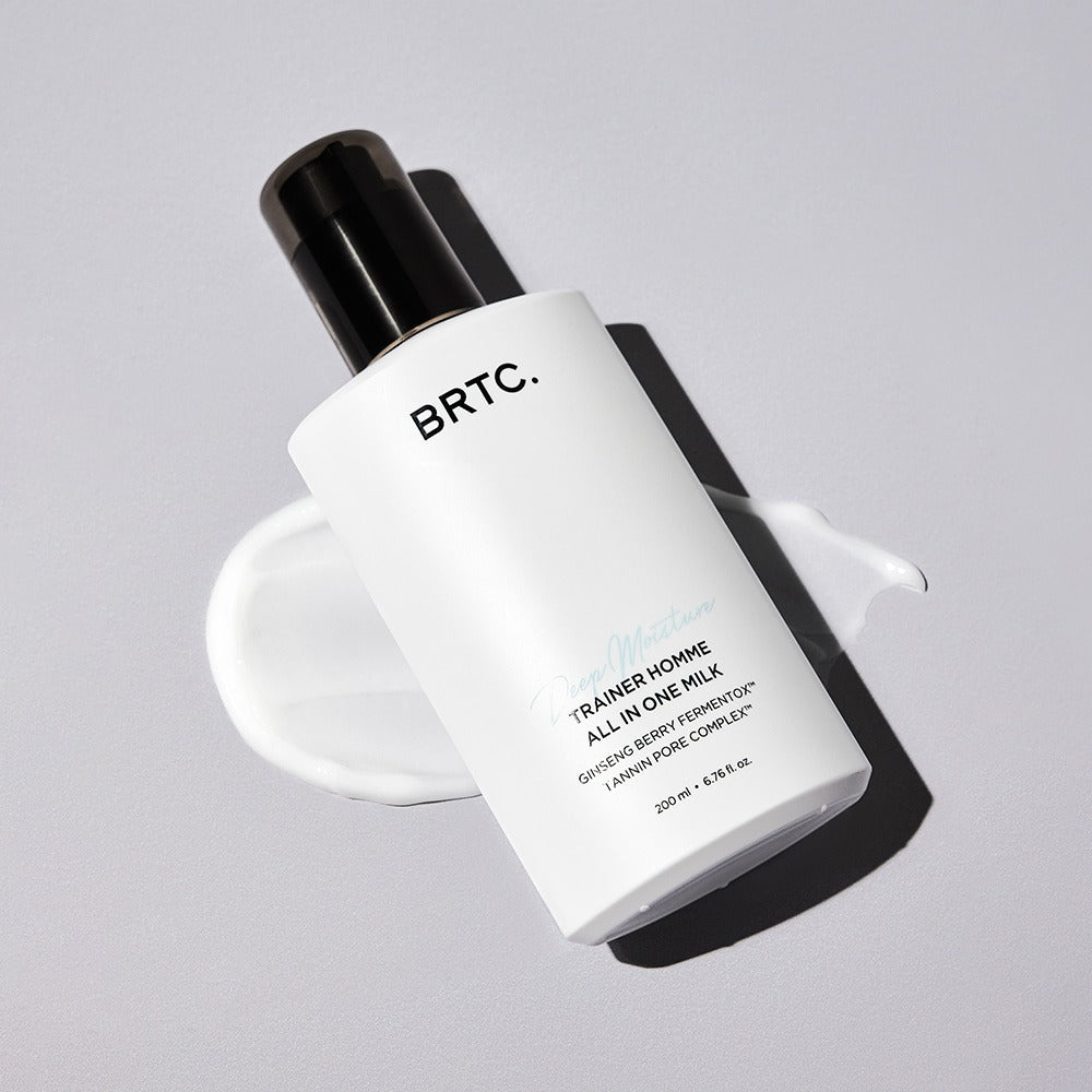 BRTC Trainer Homme ALl-in-One Milk 200ml bottle on gray background with cream swatch – Gentleman Korea Korean men’s skincare