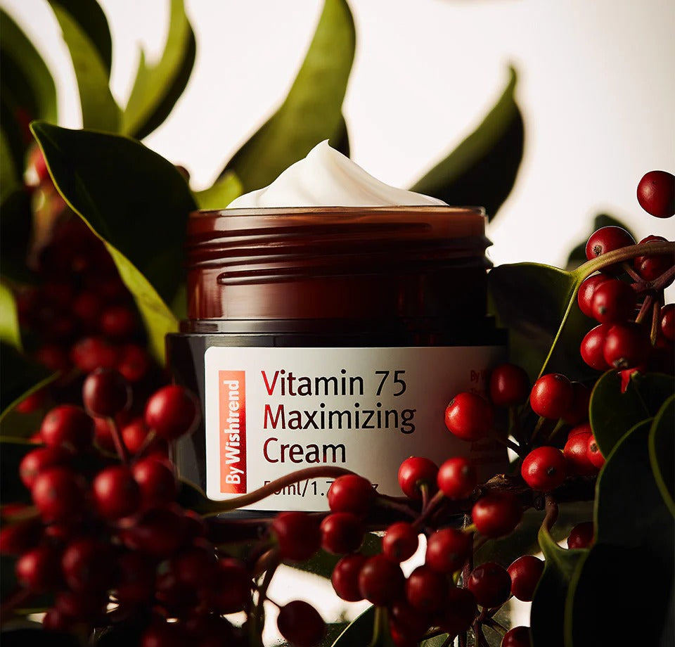 BY WISHTREND Vitamin 75 Maximizing Cream 50g surrounded by red berries and green leaves.