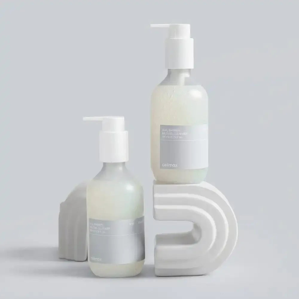 CELIMAX Dual Barrier Mild Gel Cleanser 200ml bottles displayed on abstract shapes, showcasing gentle skincare formula