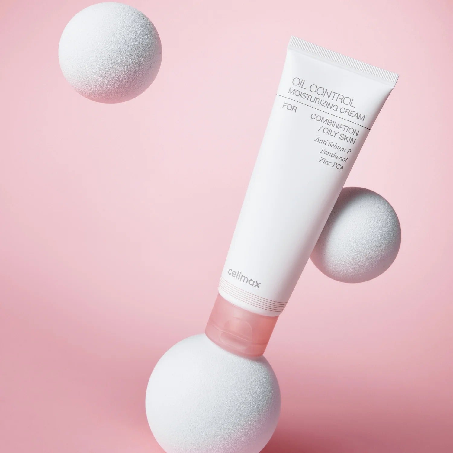 CELIMAX Oil Control Moisturizing Cream 80ml on a pink background with white spheres