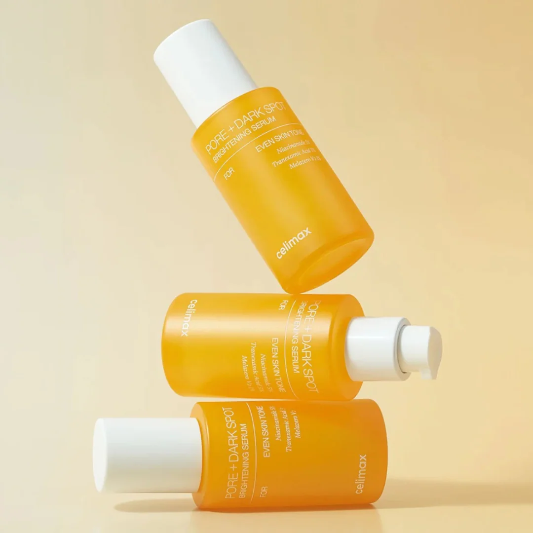 CELIMAX Pore Dark Spot brightening Serum 30ml bottles stacked elegantly on a beige background.
