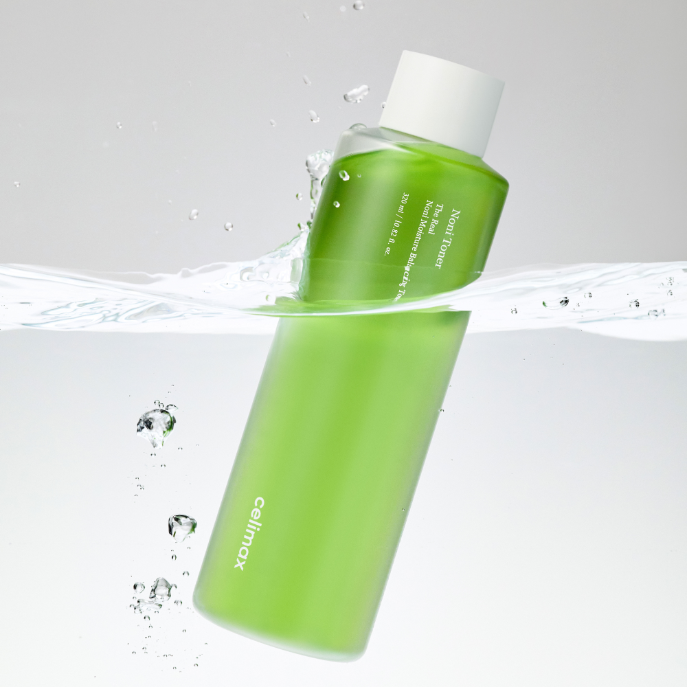 CELIMAX The Real Noni Moisture Balancing Toner 320ml in water, green bottle, skincare product image.