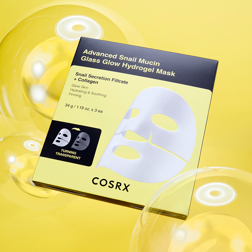 Packaging of COSRX Advanced Snail Mucin Glass Glow Hydrogel Mask (3 mask) against a yellow background