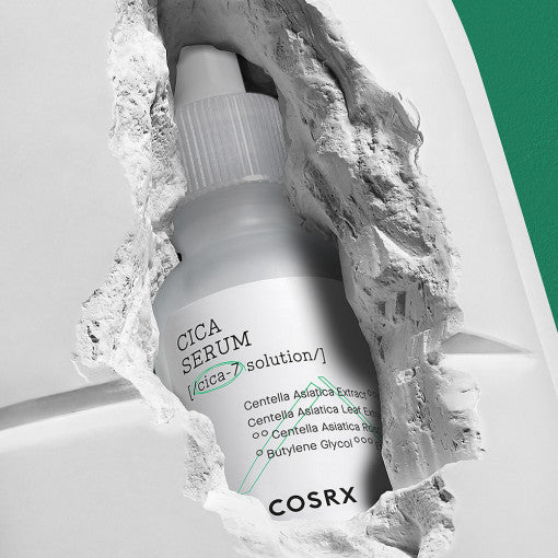 Image of COSRX Pure Fit Cica Serum 30ml showcased in a creative cracked design, emphasizing skincare benefits and product features.