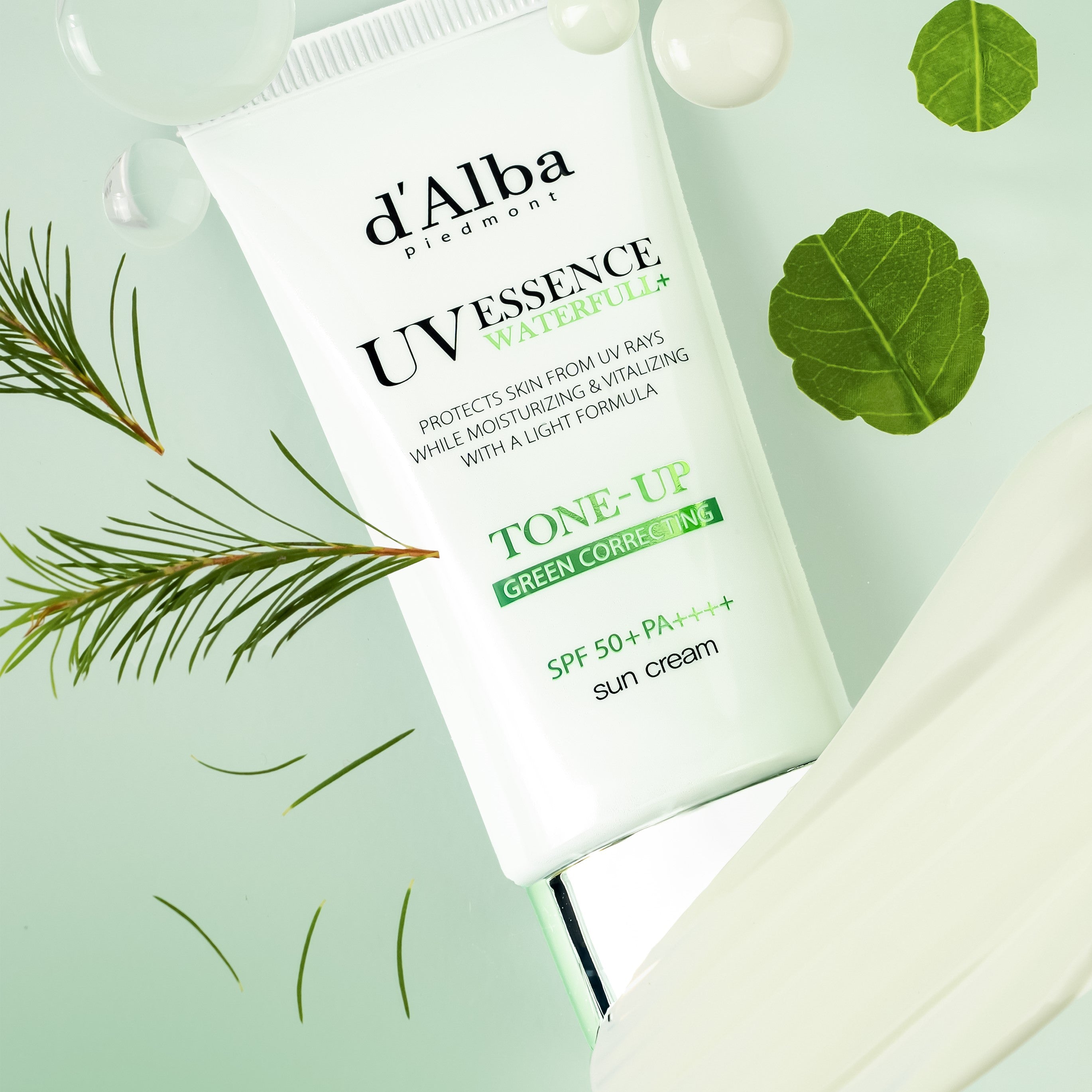 D'ALBA Vegan Waterfull Green Tone-Up Suncream 50ml packaging displayed with green leaves and droplets.
