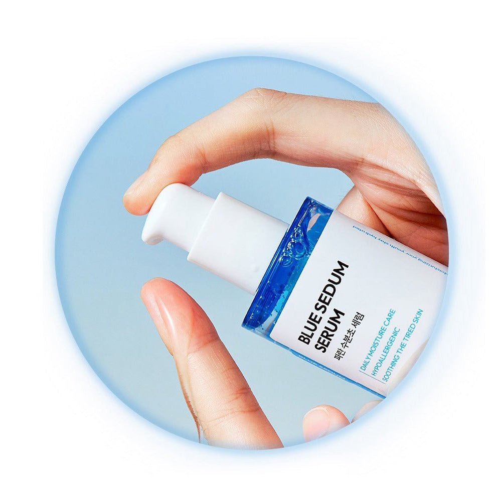 Hand holding DASHU Boy Blue Moisture Serum 65ml bottle against sky background