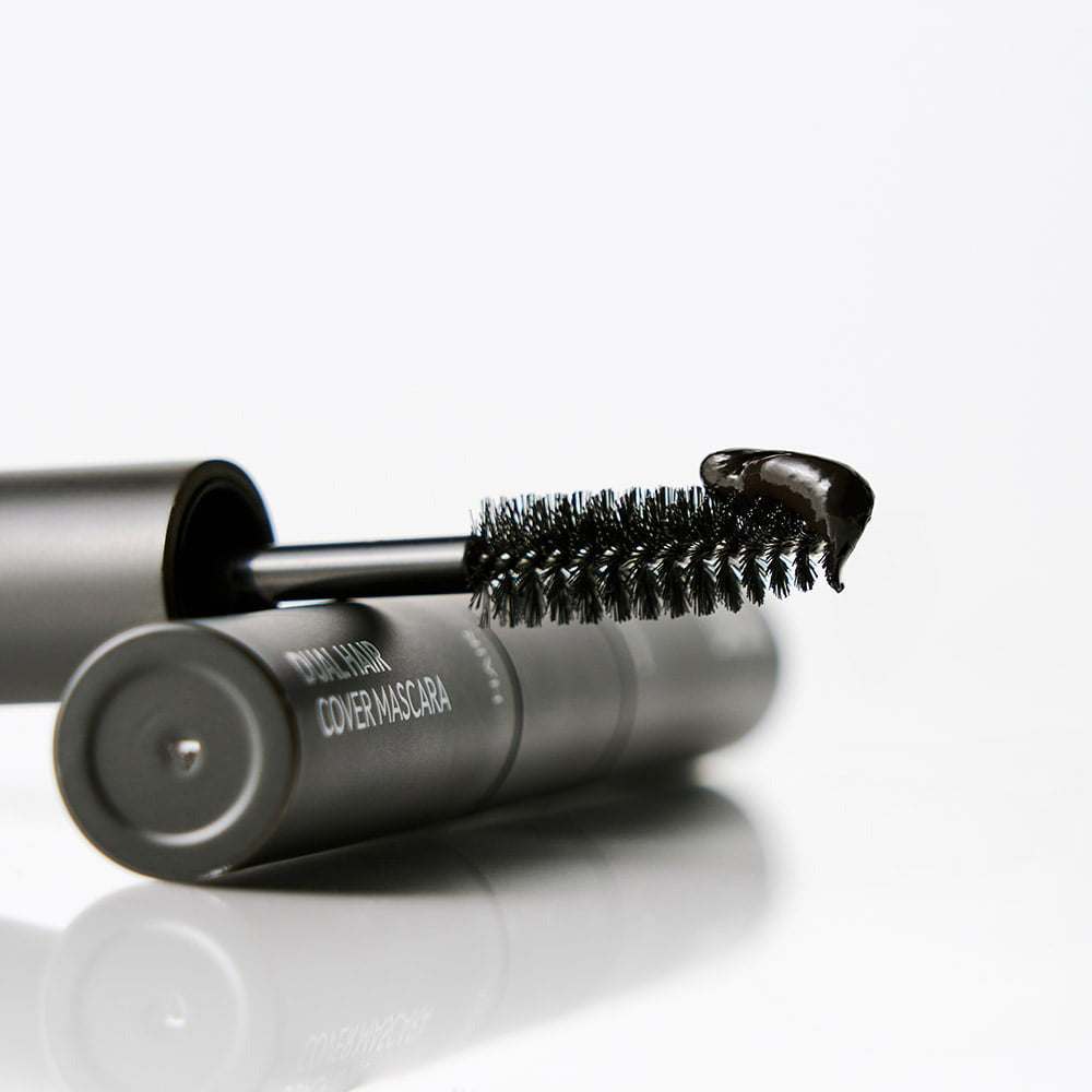 Close-up of DASHU Daily Dual Hair Cover Mascara wand with product on the tip