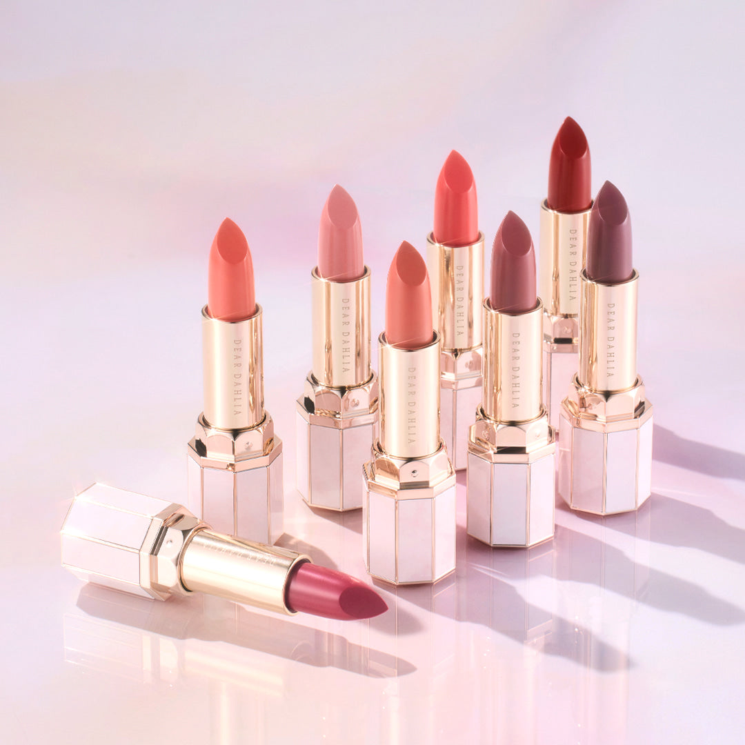 DEAR DAHLIA Lip Paradise Sensual Lip Glow shades displayed with elegant packaging on a light surface.
