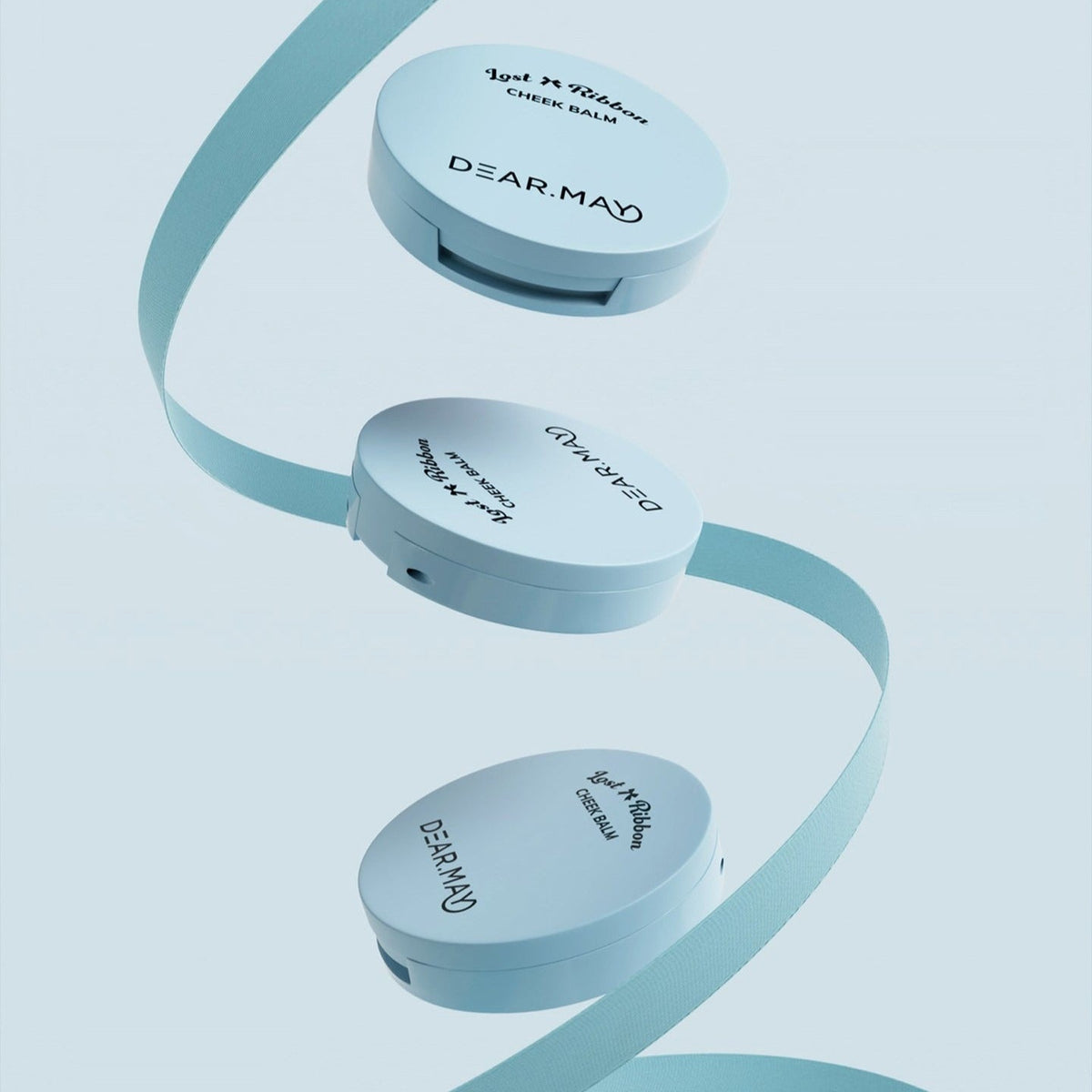 DEAR MAY Lost Ribbon Check Balm in sleek packaging with decorative ribbon, showcasing elegant design and branding.