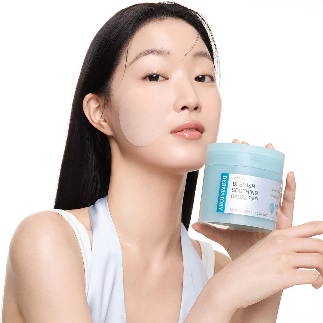 Woman holding DERMATORY Cica Exosome Blemish Soothing Gauze Pad 70 Pads, showcasing skincare product for blemish soothing.