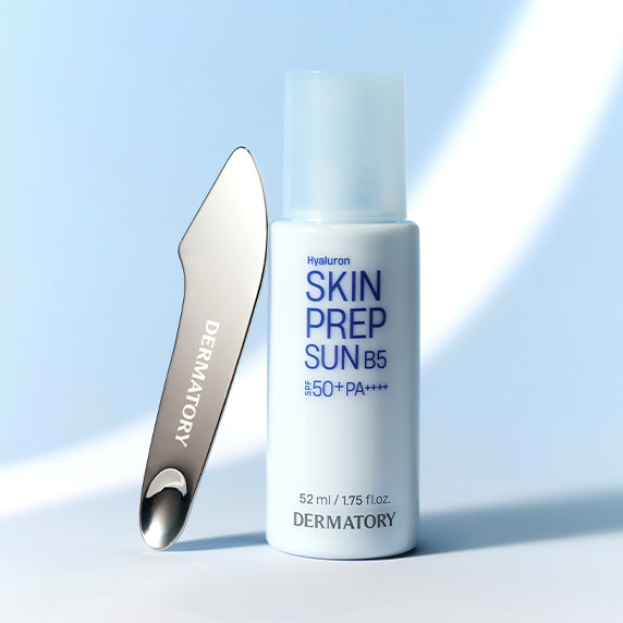 DERMATORY Hyaluronic Skin Prep Sun Cream B5 52ml with applicator against blue background
