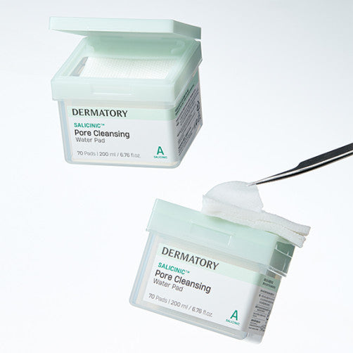DERMATORY Salicinic Pore Cleansing Water Pad with open lid and pad lifted by tweezers.