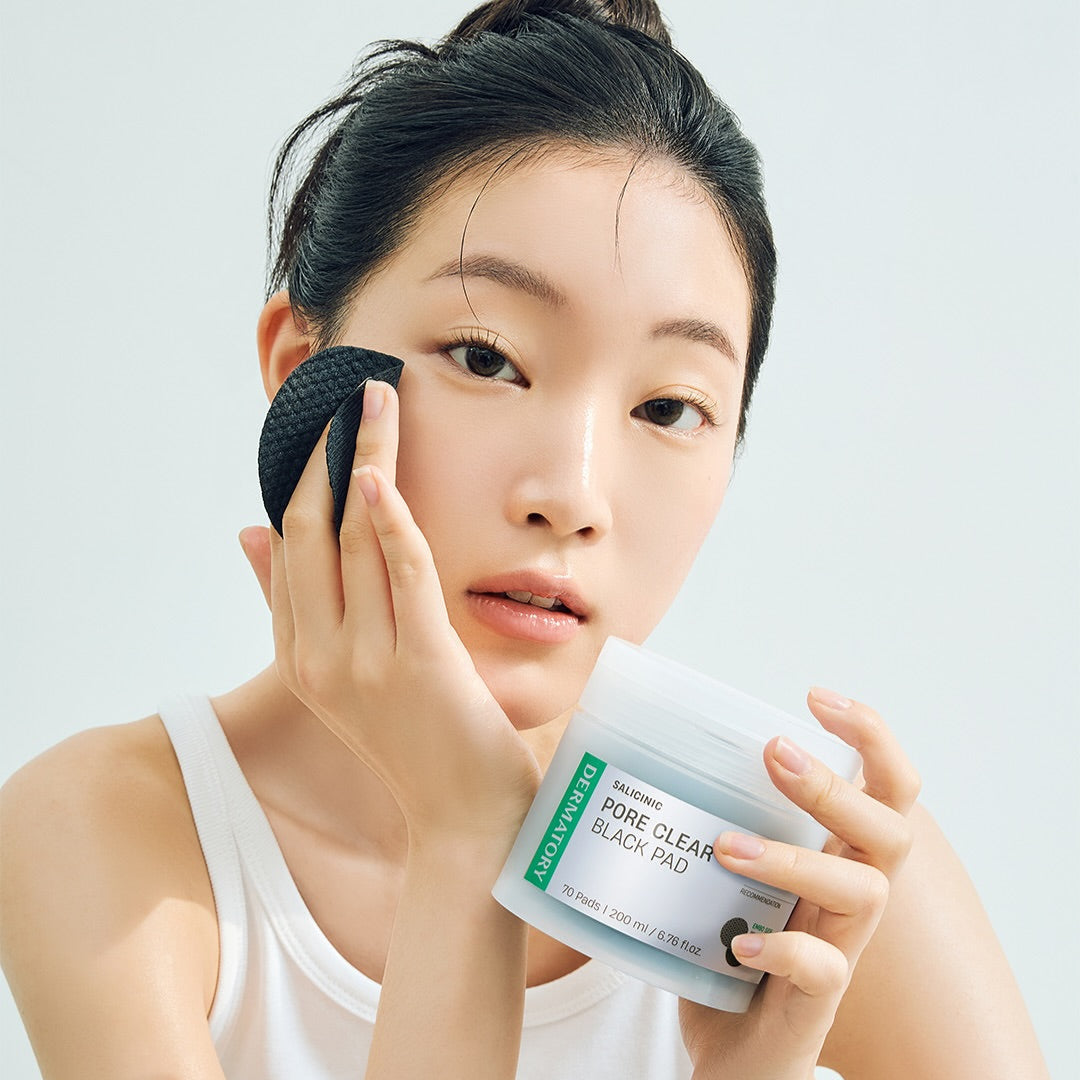 Woman using DERMATORY Salicinic Pore Clear Black Pad 70 Pads for skincare routine