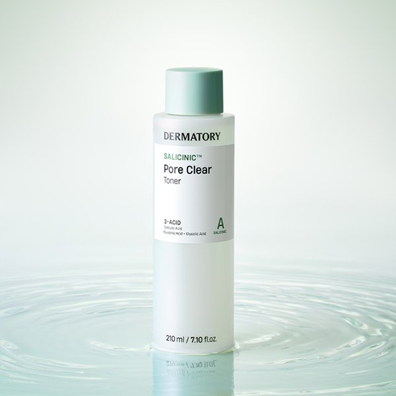 DERMATORY Salicinic Pore Clear Toner 210ml displayed on a reflective surface, highlighting its sleek packaging and benefits for clearer skin.