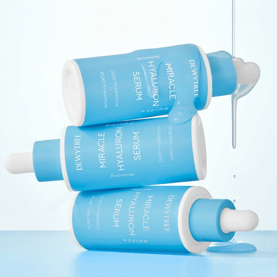 DEWYTREE Miracle Hyaluronic Serum 40ml bottles stacked with liquid dripping from dropper