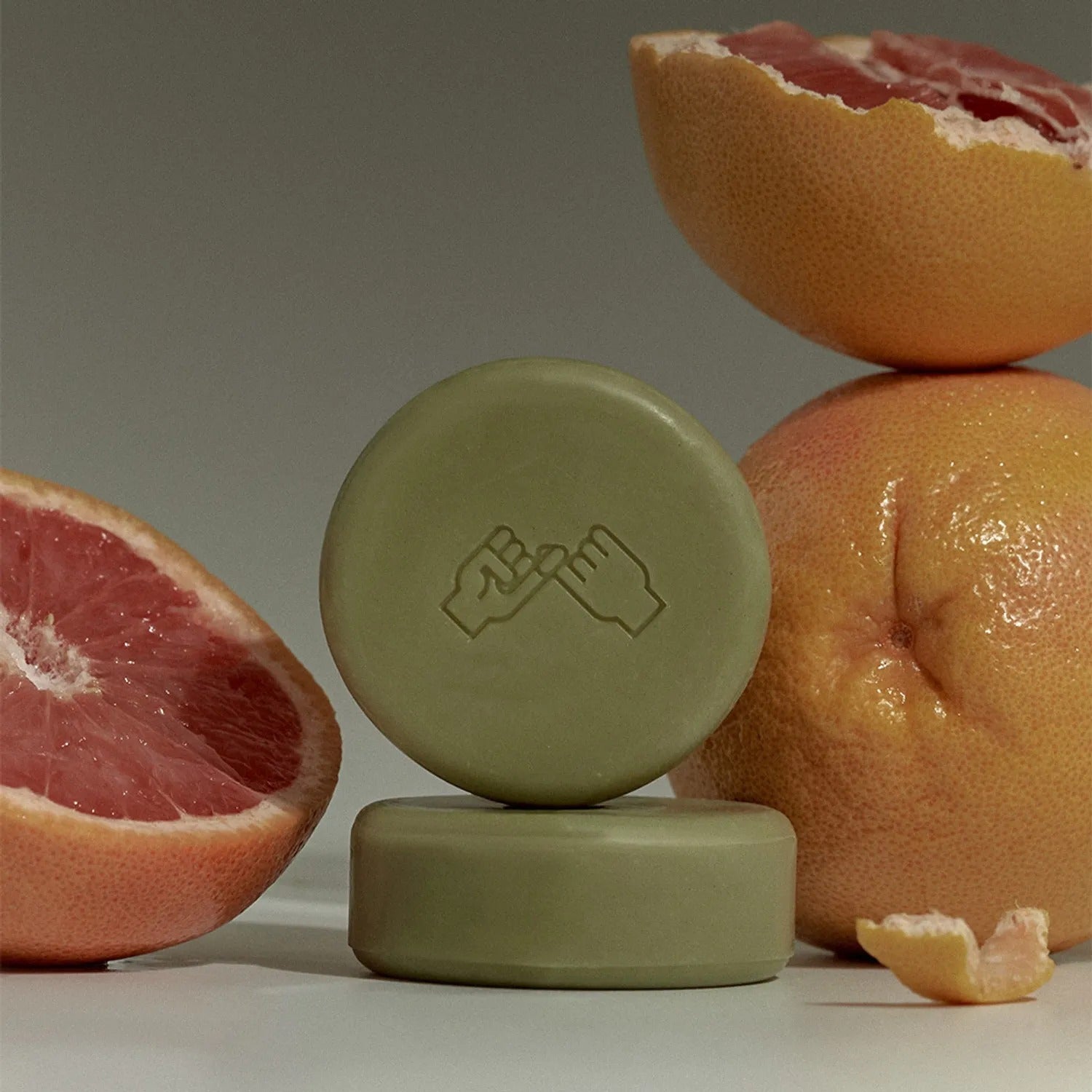 DONGGUBAT Correct Shampoo Bar For Dry Skin with grapefruit background.