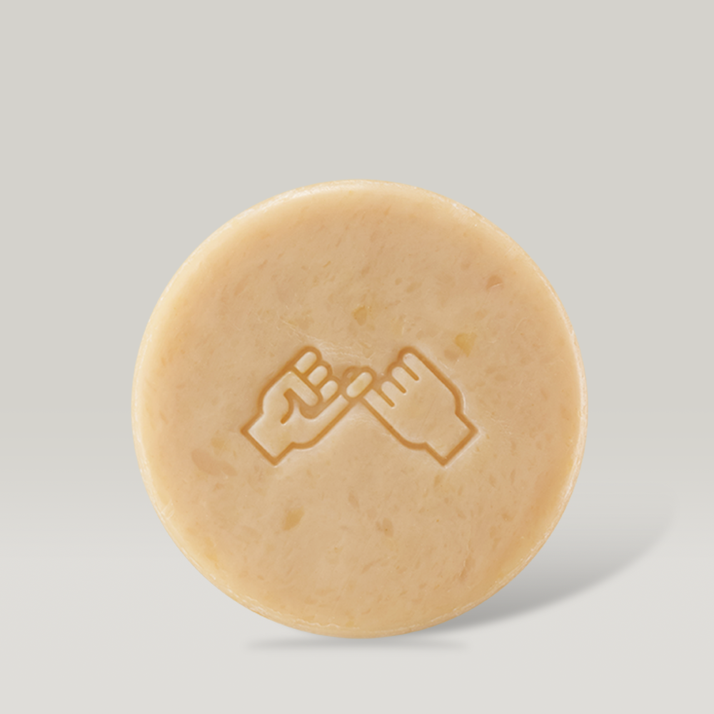 DONGGUBAT Dishwashing Soap Green Tangerine 100g round bar with hand design on light background
