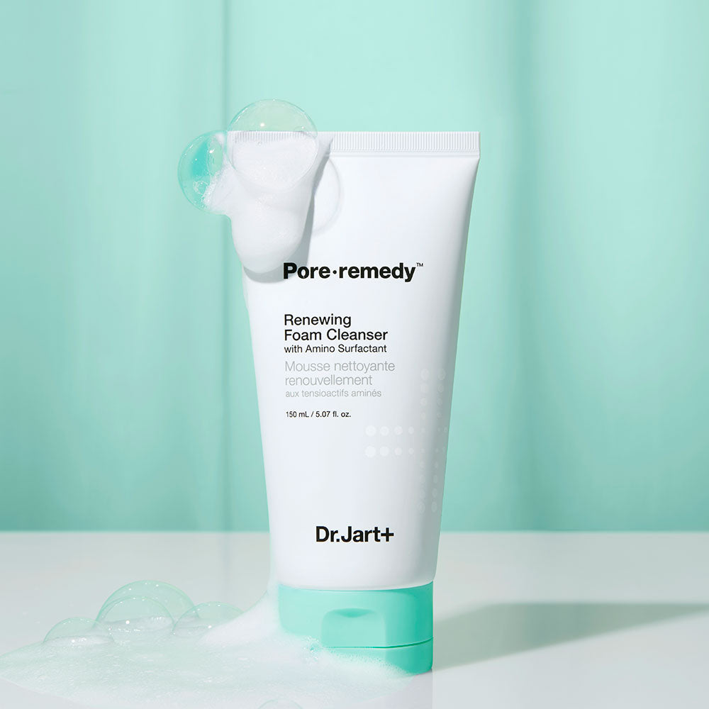 DR. JART+ Pore Remedy Renewing Foam Cleanser 150ml tube with foam bubbles against green background