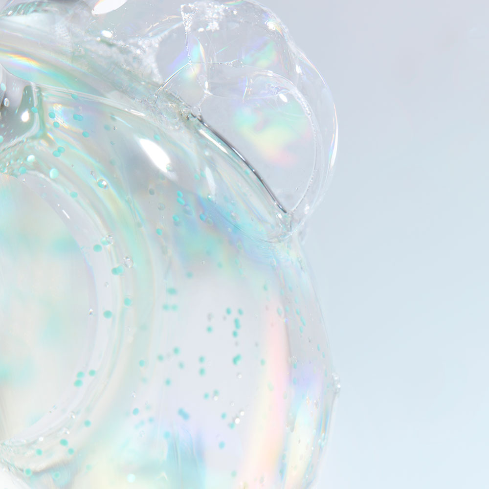 Close-up of DR. JART+ Pore Remedy Renewing Foam Cleanser 150ml texture with iridescent bubbles