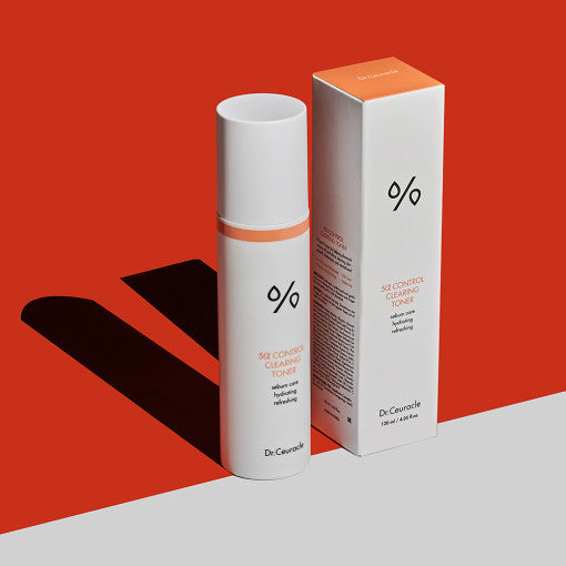 DR.CEURACLE 5α Control Clearing Toner 120ml bottle and packaging on red background