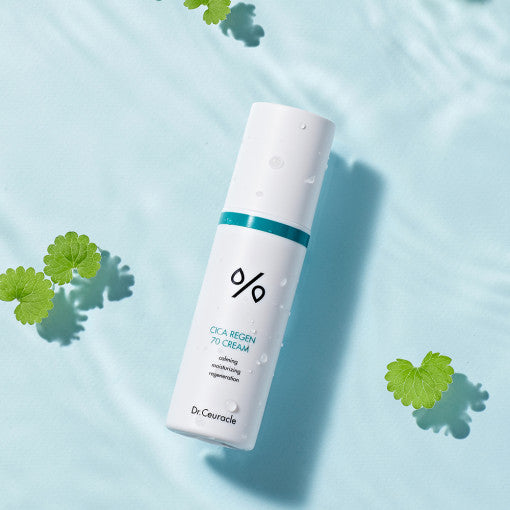 DR.CEURACLE Cica Regen 70 Cream 50ml bottle on blue surface with green leaves