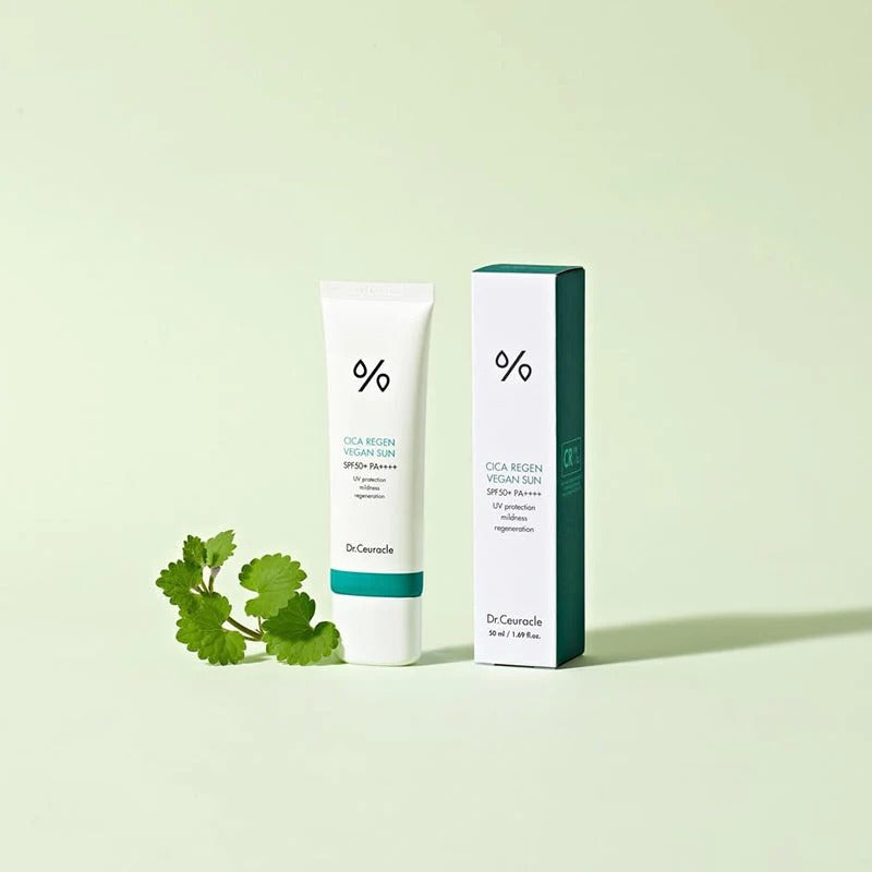 DR.CEURACLE Cica Regan Vegan Sun SPF50+PA++++ 50ml sunscreen product image with packaging and cica plant on light green background