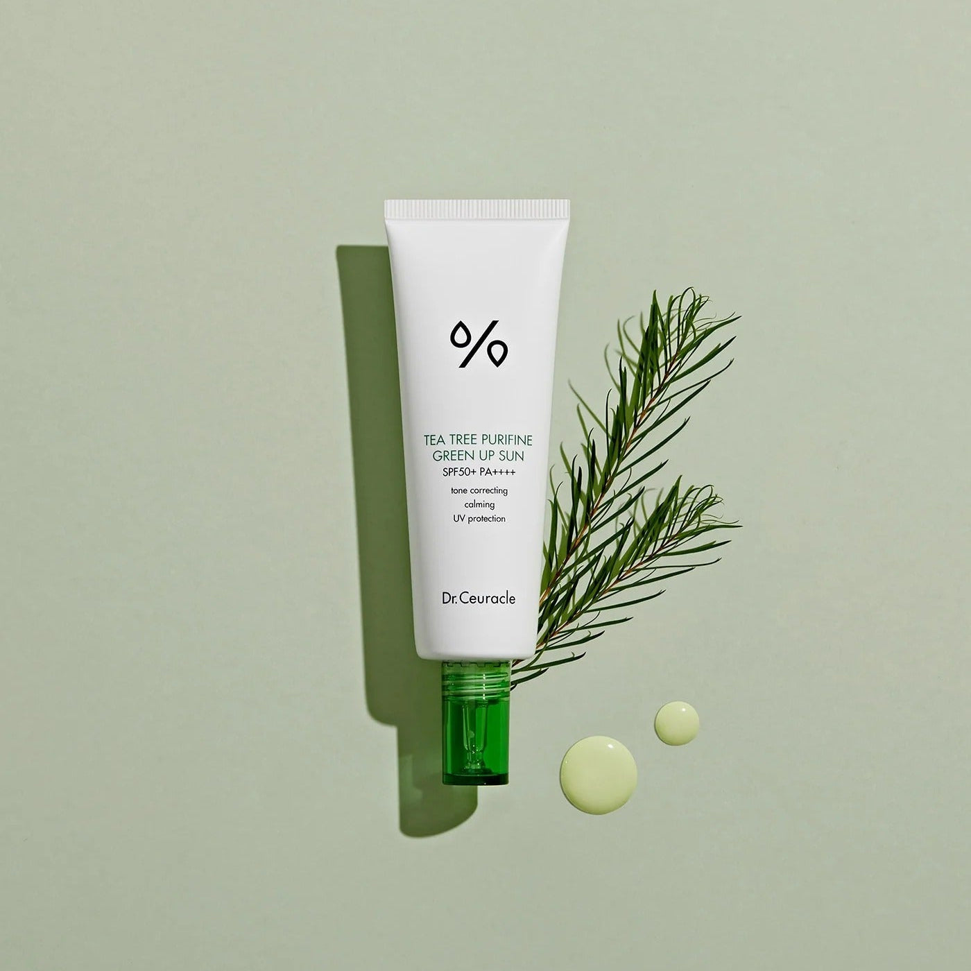 DR.CEURACLE Tea Tree Purifine Green Sup Sun 50ml with greenery backdrop