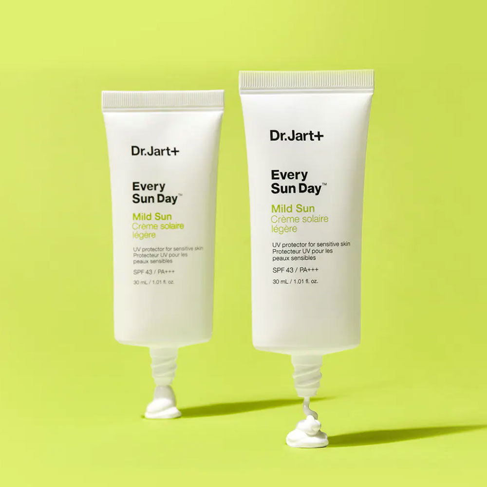 Two tubes of DR.JART+ Every Sun Day Mild Sun 30ml on a green background, showcasing their mild sun protection formula.