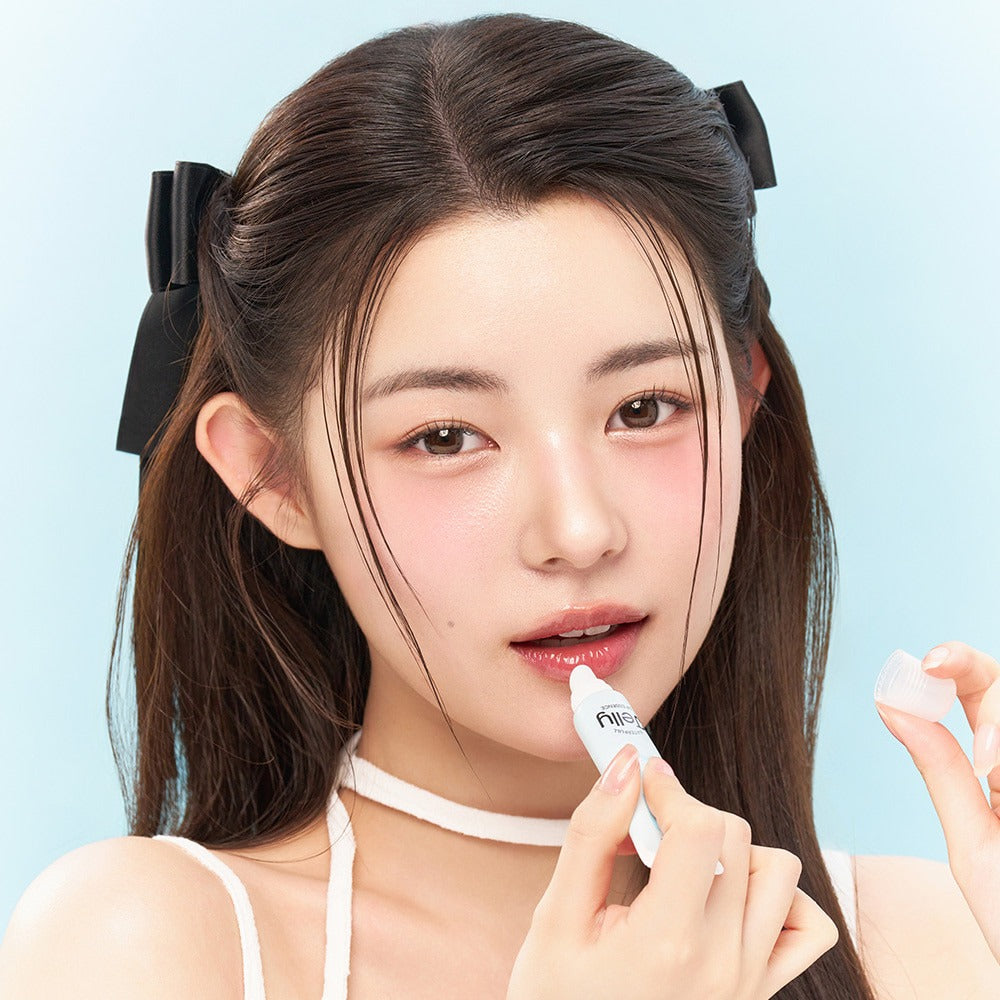 Model applying EDIT.B Waterful Jelly Lip Essence 11ml, showcasing glossy lip effect.