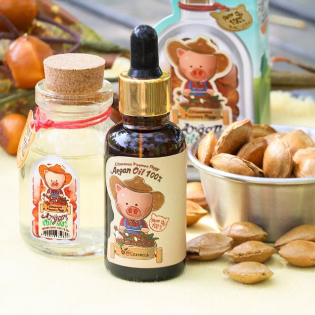 ELIZAVECCA Farmer Piggy Argan Oil 100% 30ml bottle with argan seeds and packaging, skincare product on display.