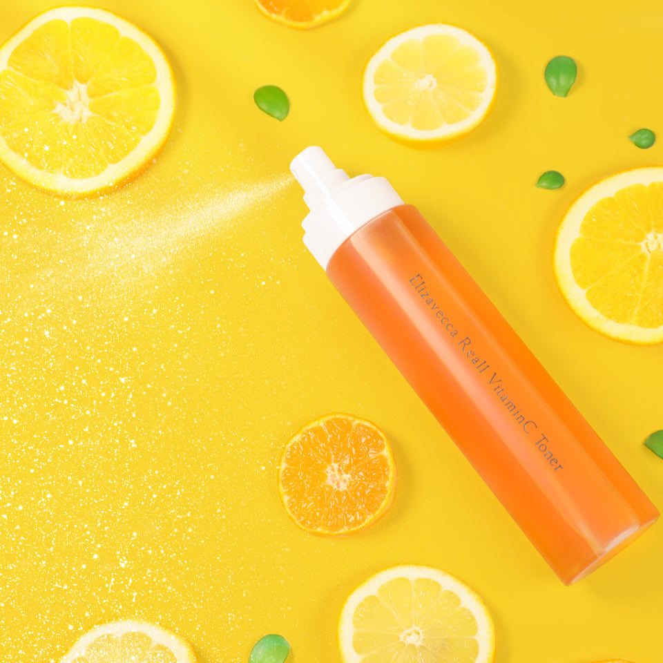 ELIZAVECCA Real One Vitamin C Toner 200ml bottle with citrus fruits on a yellow background