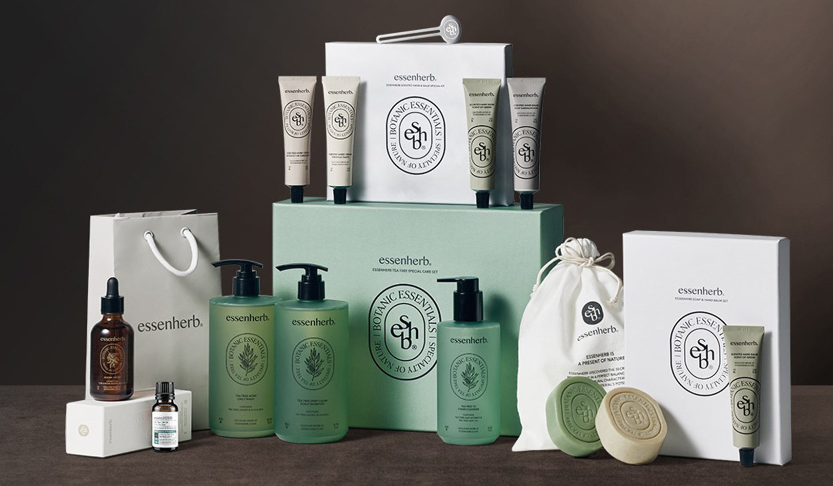 Essenceherb skincare product display including creams, bottles, soap bars, and branded packaging on a dark background.