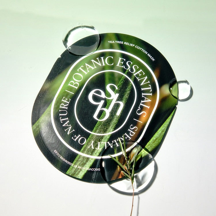 ESSENHERB Tea Tree Relief Cotton Mask 5EA packaging with natural design and water droplets on surface.