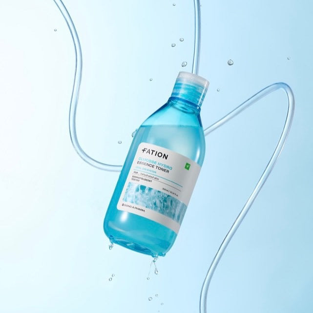 FATION Glucose Hydro Essence Toner 500ml product image with clear blue bottle on a light blue background.