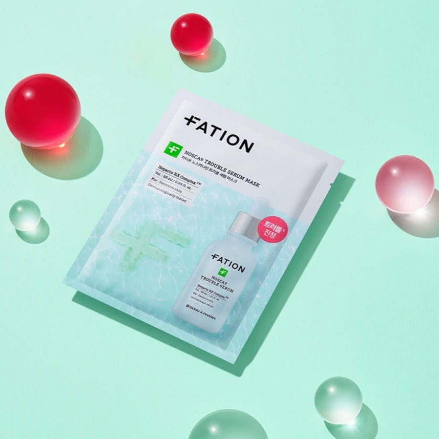 FATION Nosca9 Trouble Serum Mask on a mint background with colorful orbs, highlighting skincare benefits and packaging.