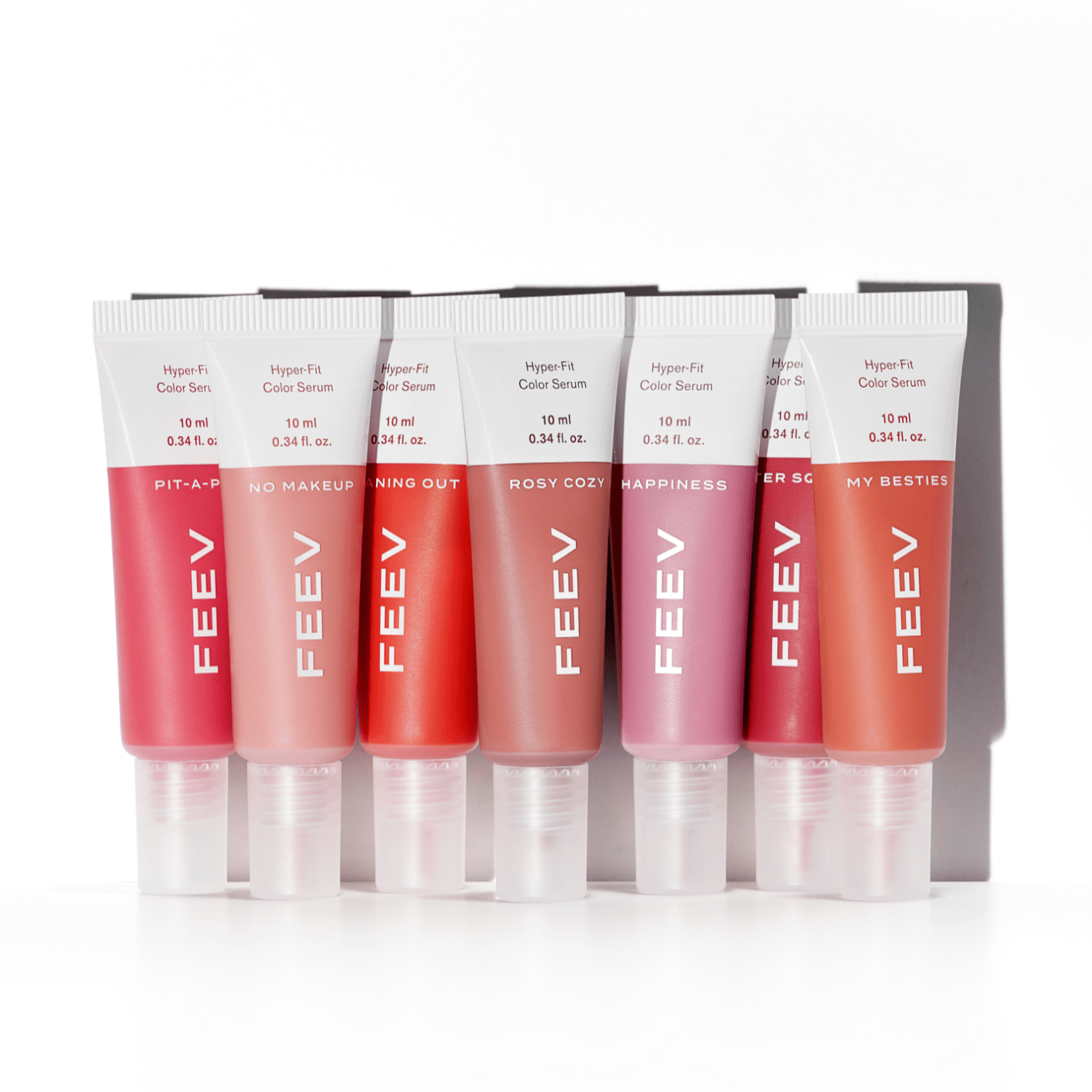 Collection of FEEV Hyper-Fit Color Serum Mini Blush tubes displayed in various shades.