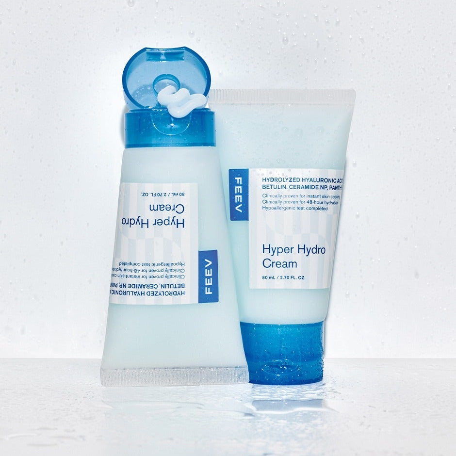 FEEV Hyper Hydro Cream 80ml with hydrating formula in two blue and white tubes on wet surface.