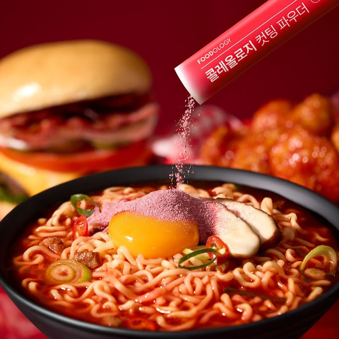 FOODOLOGY Cutting Powder being sprinkled on ramen bowl with burger and chicken on the side.
