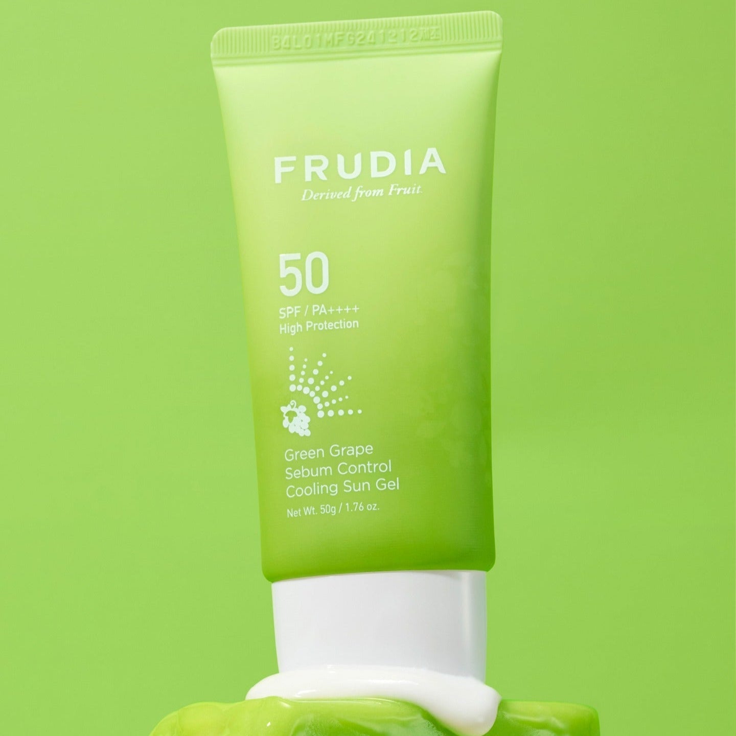FRUDIA Green Grape Sebum Control Cooling Sun Gel 50g tube on green background.