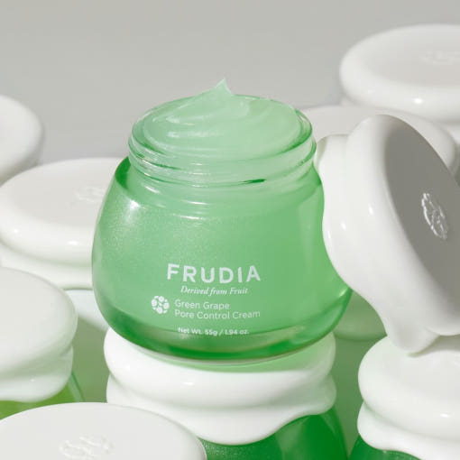 FRUDIA Green Grape Pore Control Vegan Cream 55ml in an open green jar with white lids.