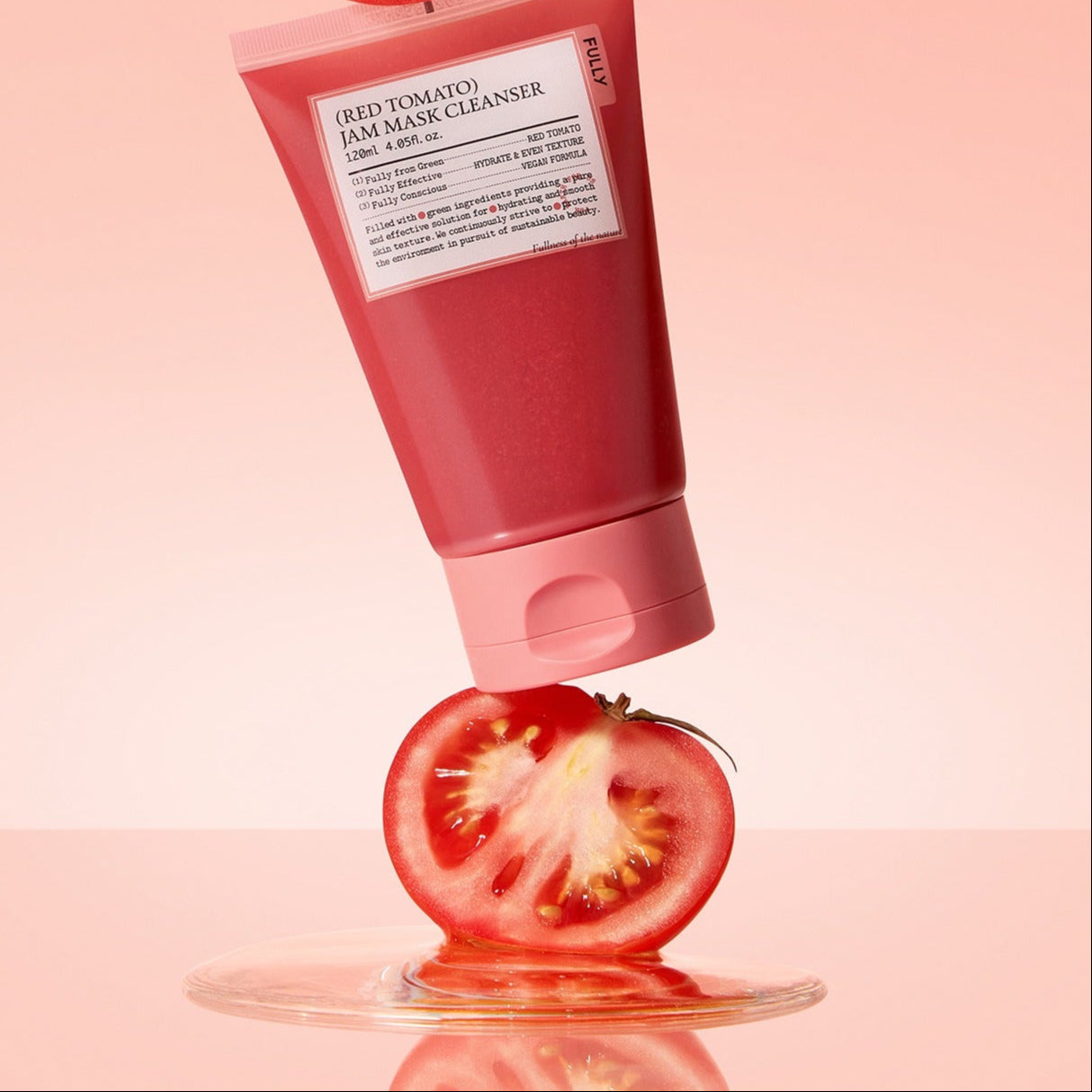 FULLY Red Tomato Jam Pack Cleanser 120ml on a sliced tomato, pink background