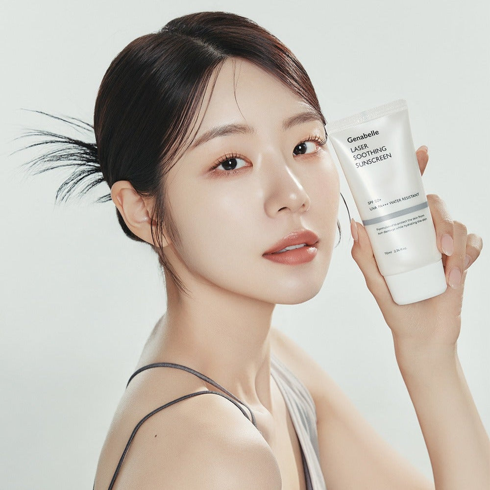 Young woman holding GENABELLE Laser Soothing Sunscreen 70ml, showcasing the product's sleek design and packaging.