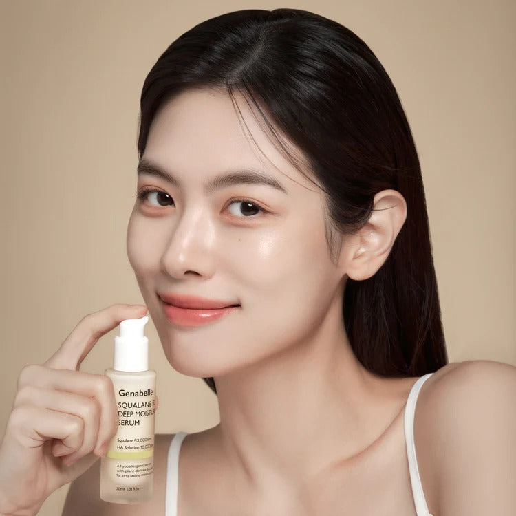 Woman holding GENABELLE Squalane 53 Deep Moisture Serum 30ml, showcasing smooth skin and a radiant complexion.